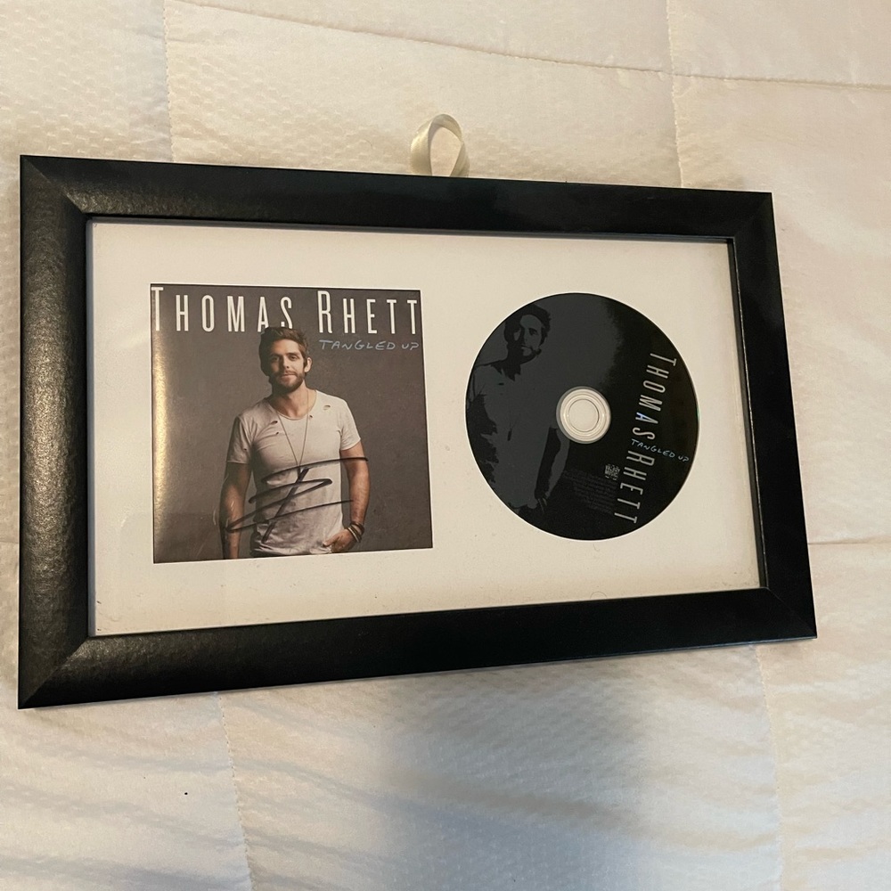 Signed and framed Thomas Rhett “Tangled Up” CD
